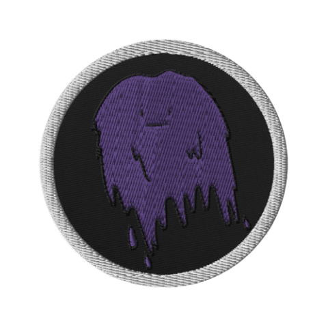 Round embroidered patch showing the purple slime on a black background